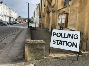 Polling station sign outside a church building